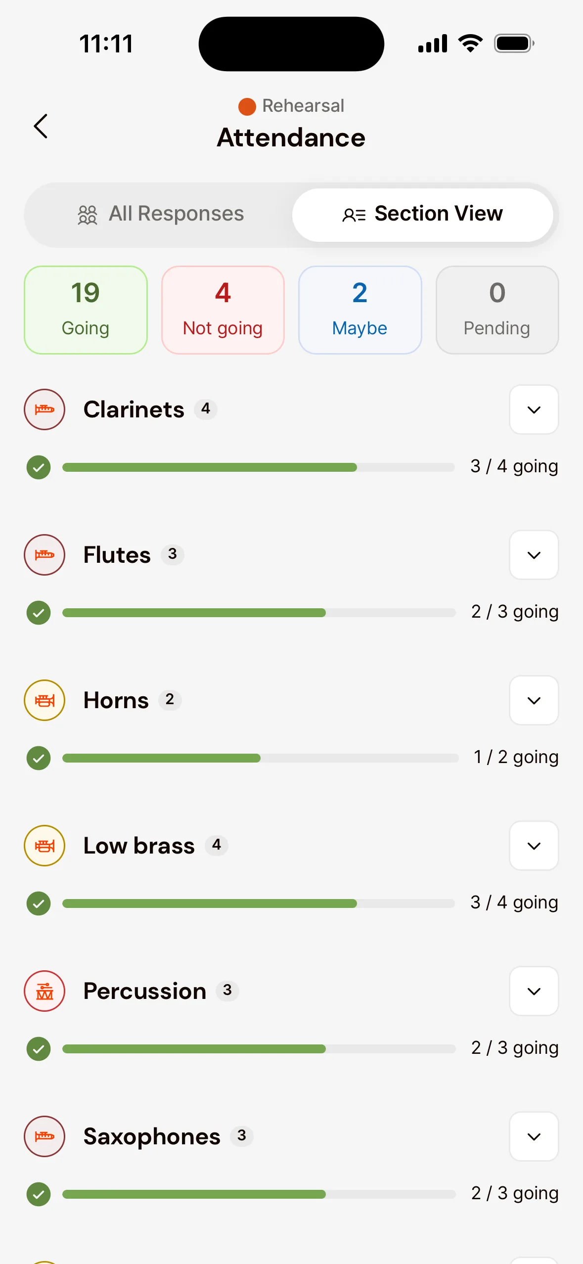 The Attendance screen of a rehearsal in the app with Section View chosen: the Going, Not going, Maybe and Pending counts, and per section, such as Clarinets, Flutes and Horns, how many members are coming.