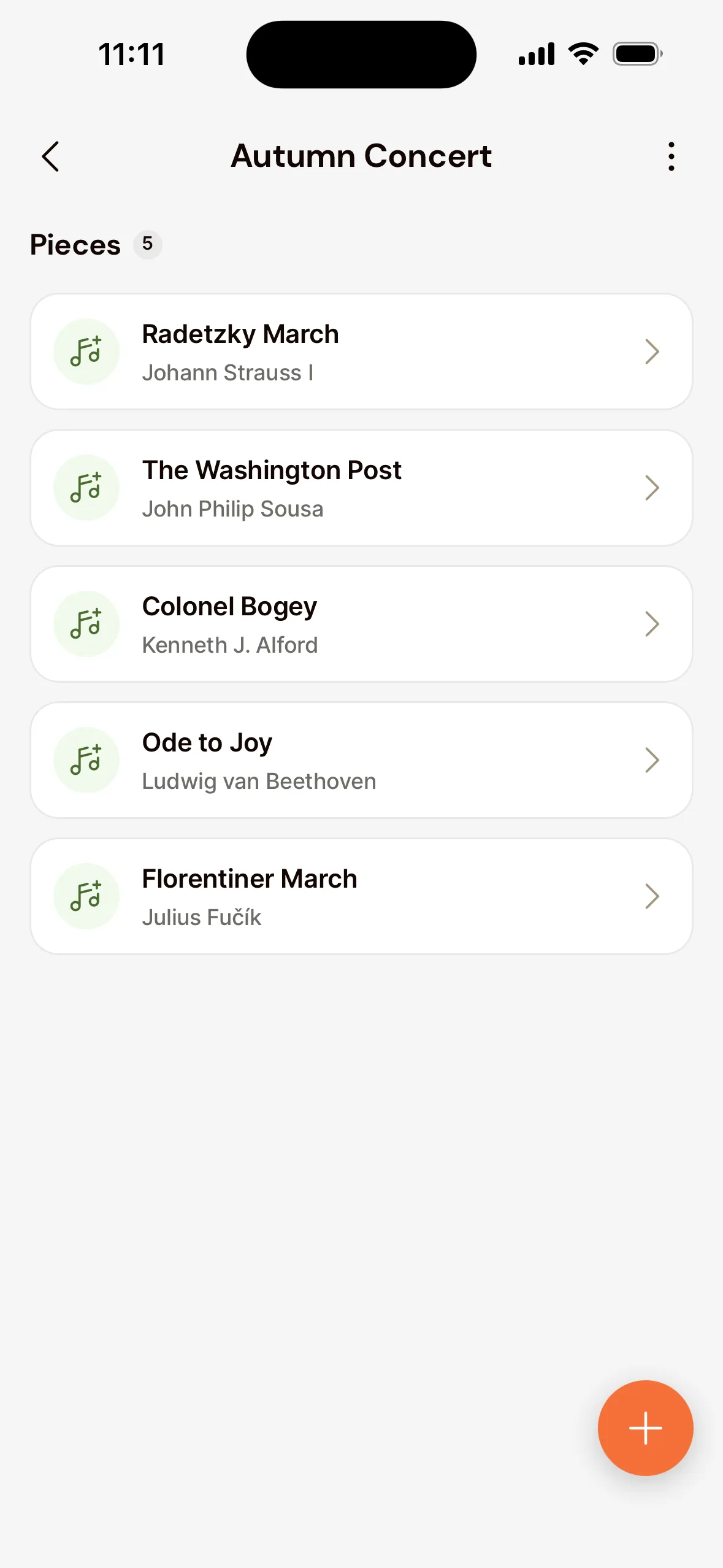 A setlist in the app: Autumn Concert with its five pieces and their composers under Pieces, and the plus button at the bottom right to add music.